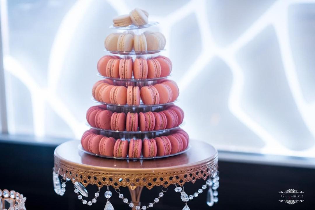 Peach and pink macaron tower on a gold stand